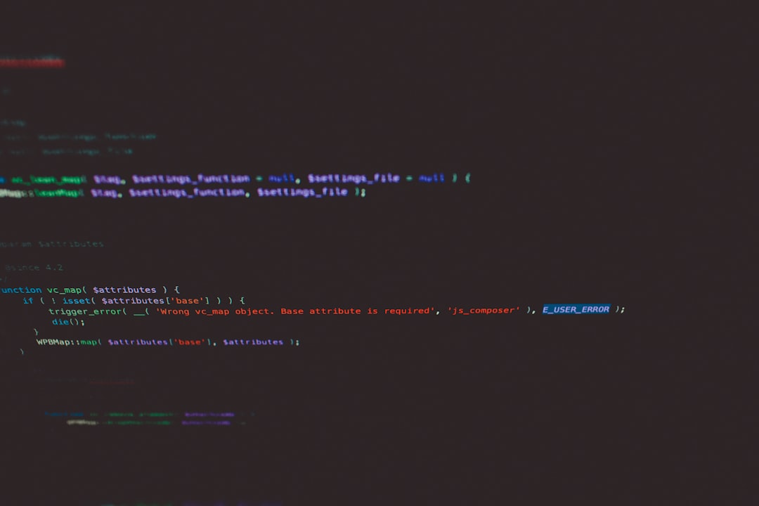developer coding with multiple screens