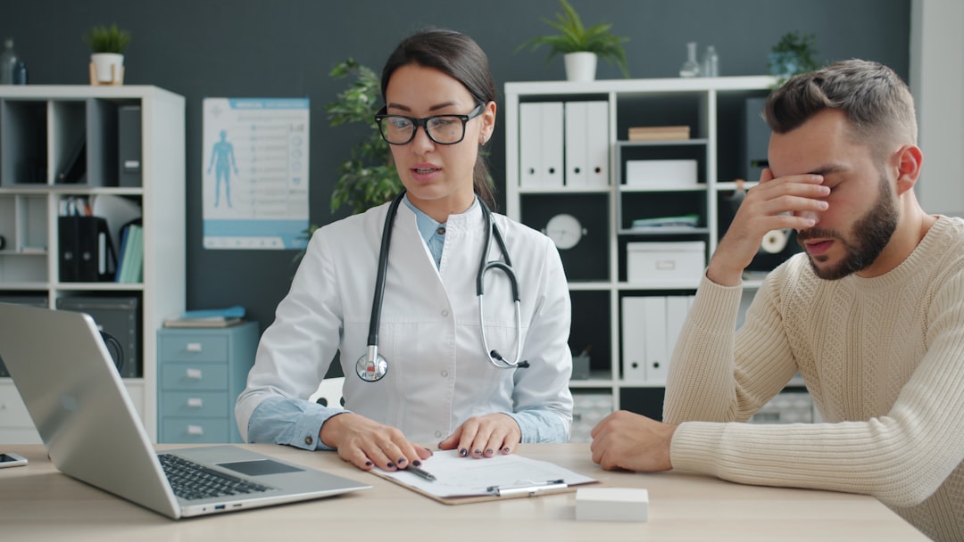 doctor with patient in consultation room