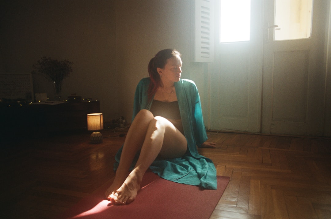 woman practicing yoga at home